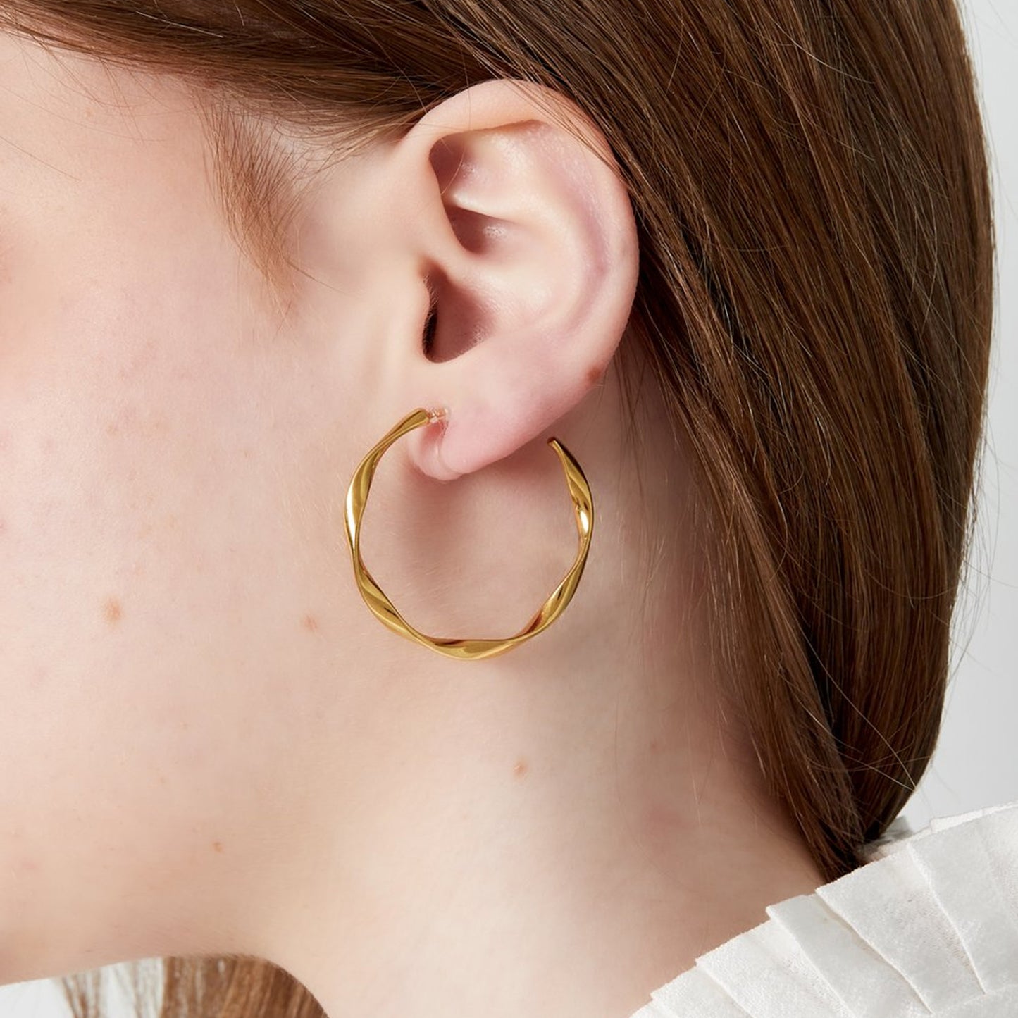 Twist Hoops Clip Oorbellen Goud